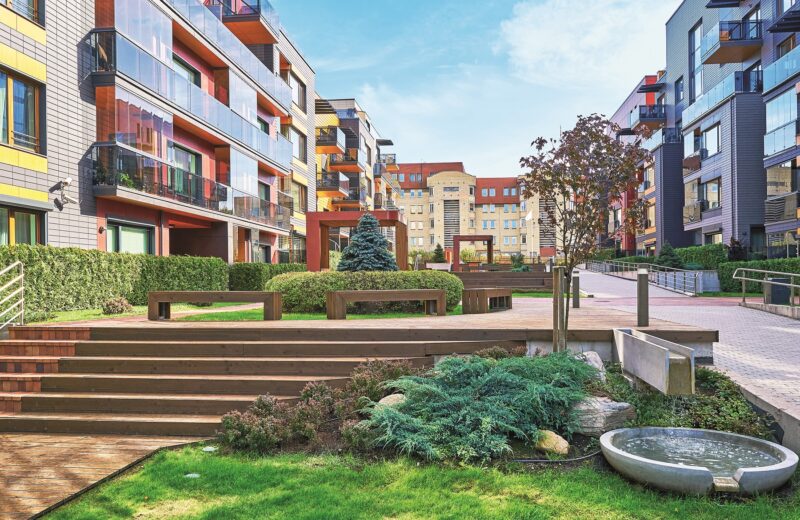 Modern complex of residential buildings with decorative fountain